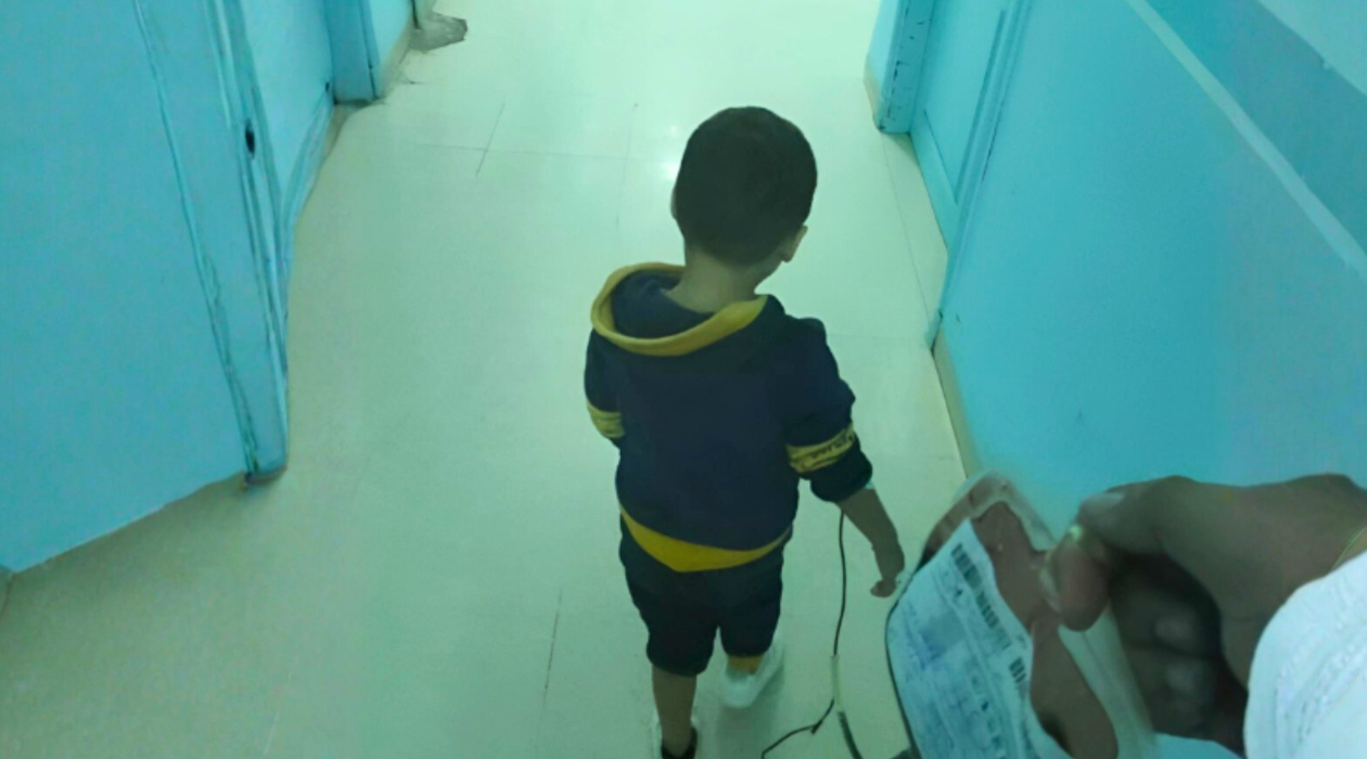 Walid in the hospital corridor